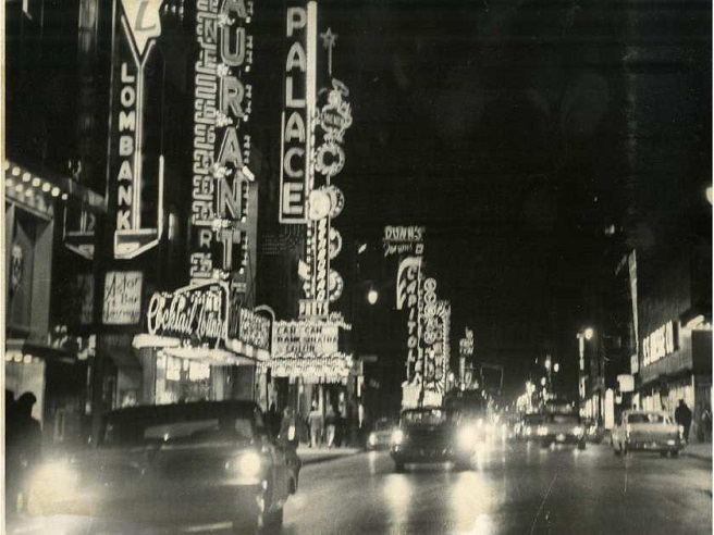 a nighttime scene in downtown Montreal of the 1950s